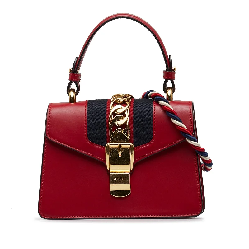 Gucci Marmont bags for women with quilted leather exteriorsGucci Sylvie Top Handle Mini Red Leather