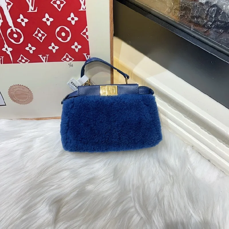 Fendi By The Way bags with a contrast - colored interior for visual interestFendi Mini Blue Shearling Bag