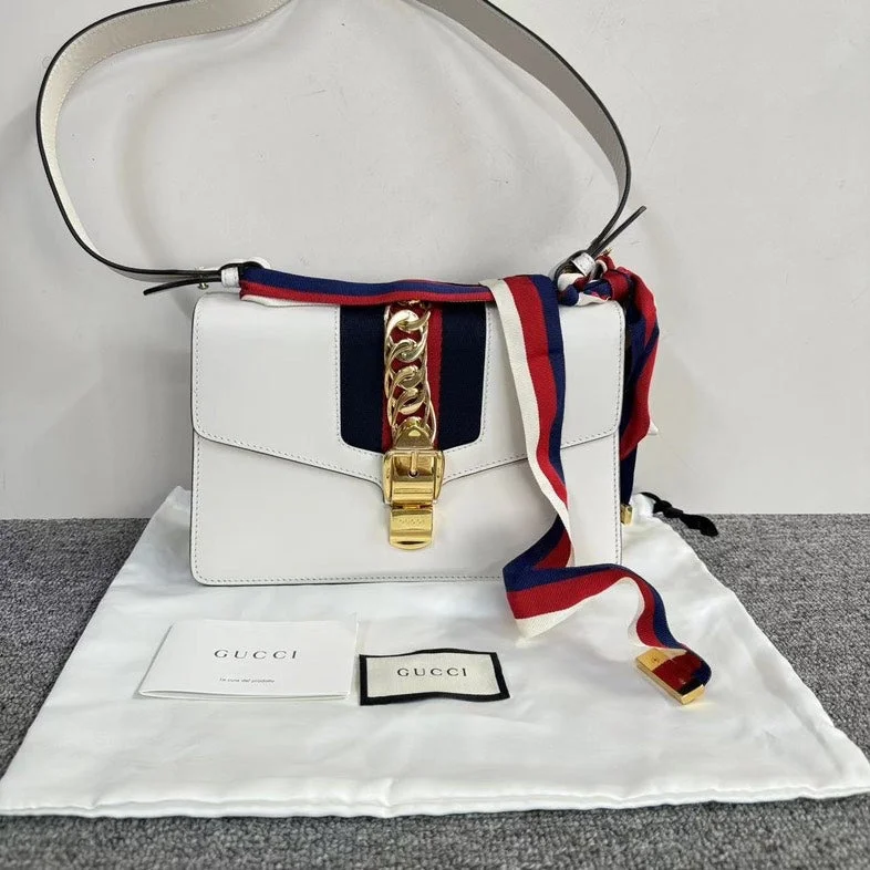 Women Gucci Sylvie bags featuring the signature web stripeGucci Sylvie White Leather Shoulder Bag with Dustbag