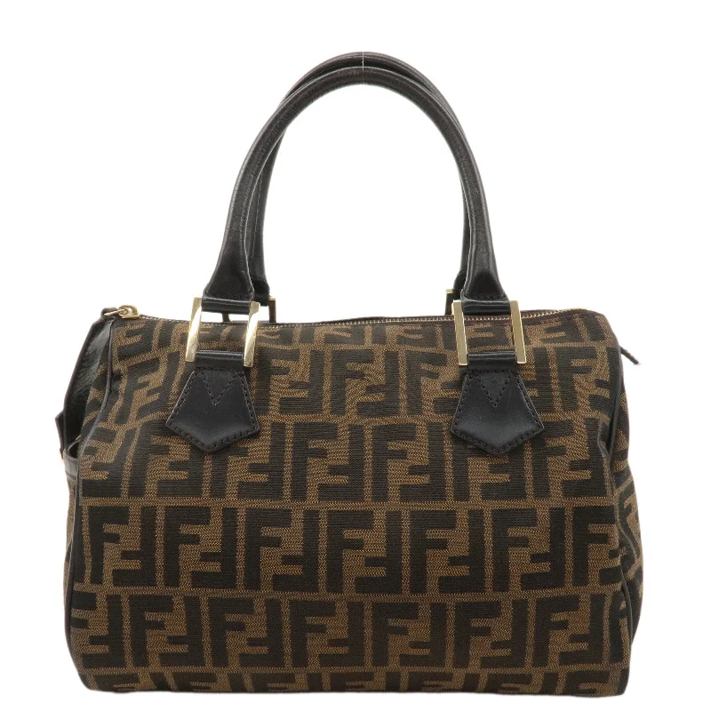 Fendi Baguette bags with a detachable charm featuring the brand's mascotFENDI Zucca Canvas Leather Mini Boston Bag Black Brown