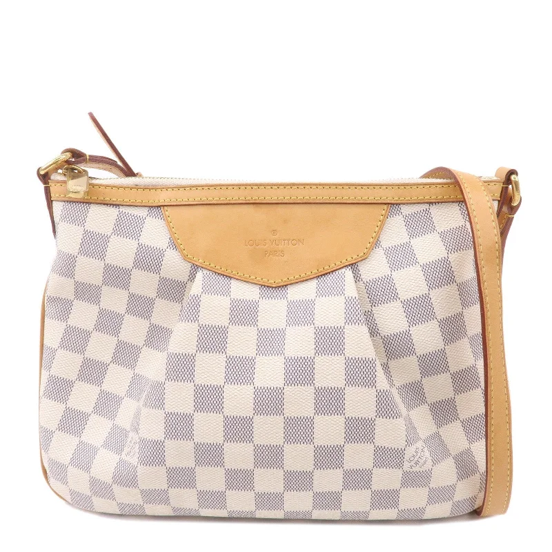 Louis Vuitton Twist bags with a contrast - colored interior for visual interestLouis Vuitton Damier Azur Siracusa PM Shoulder Bag M41113