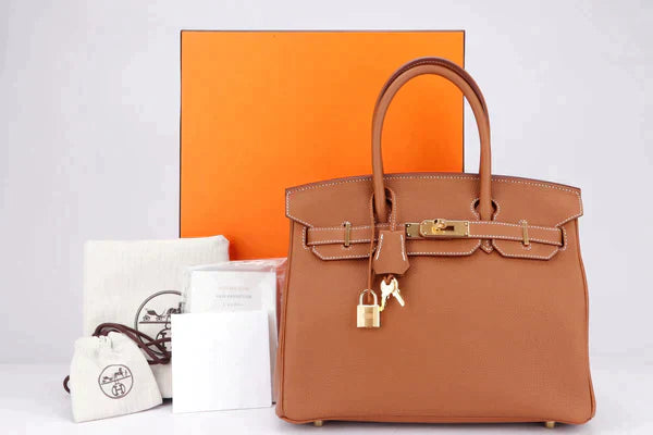 Monogram - Embellished Hermes Bags for a Personalized FlairHermes Birkin Bags with a Detachable Shoulder Pad for ComfortHERMES BIRKIN 25 - 40CM (WITH SERIAL NUMBER) GOLD COLOR TOGO LEATHER, GOLD HARDWARE, WITH KEYS, LOCK, DUST & BOX