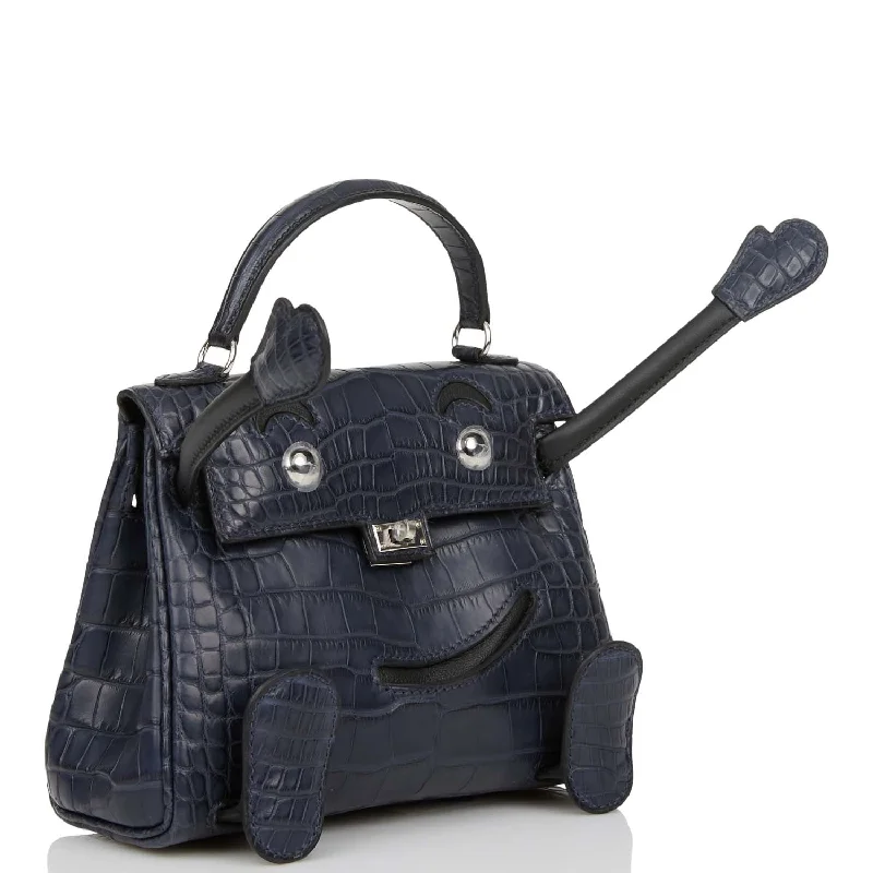 Functional Hermes Roulis Bags with Multiple CompartmentsHermès Kelly Bags in a deep indigo blue for a classic and sophisticated lookHermes  "Quelle Idolle" Kelly Doll Bleu Indigo Matte Alligator Palladium Hardware