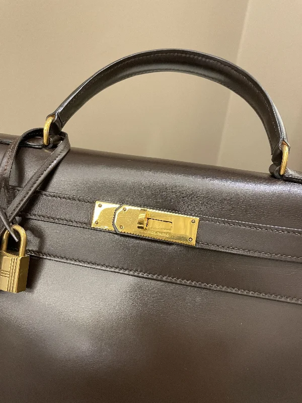 Hermes Victoria Bags with Signature Turnlock ClosuresHermès Kelly Bags in a neutral camel color for a versatile styleHermes Vintage Kelly 28 Dark Brown Box